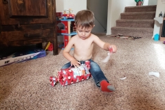 Taking his time to unwrap