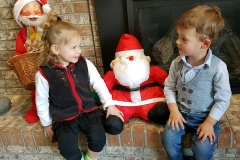 Mae and Colton making sure Santa know they were good.